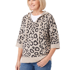 Three quarter view of the khaki leopard hooded knit sweater worn with jeans