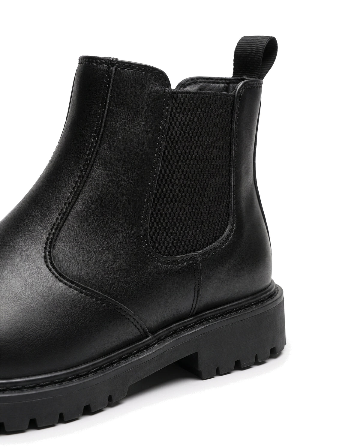 Close-up of the elastic side panel, stitching and lug sole