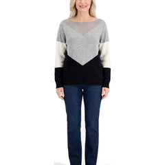 Woman wearing the black color block boat neck sweater with jeans, front standing