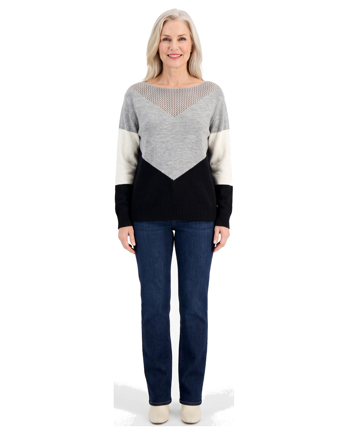 Woman wearing the black color block boat neck sweater with jeans, front standing