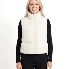Woman wearing the cream white cropped puffer vest, front