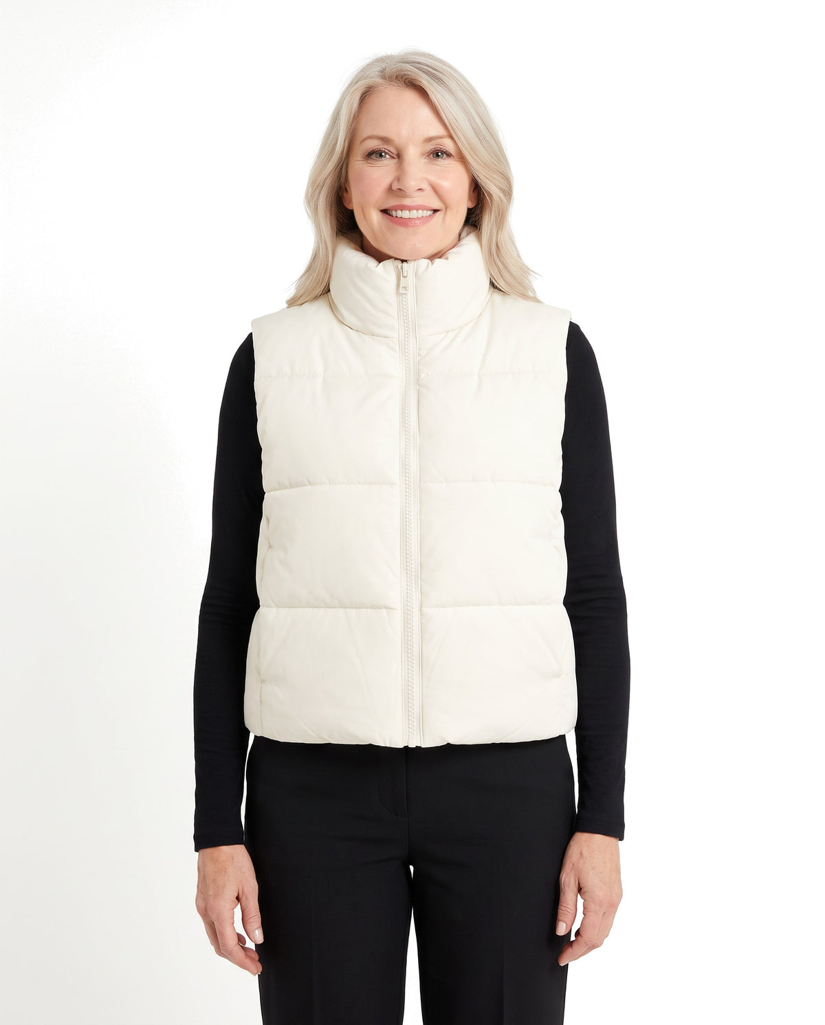 Woman wearing the cream white cropped puffer vest, front