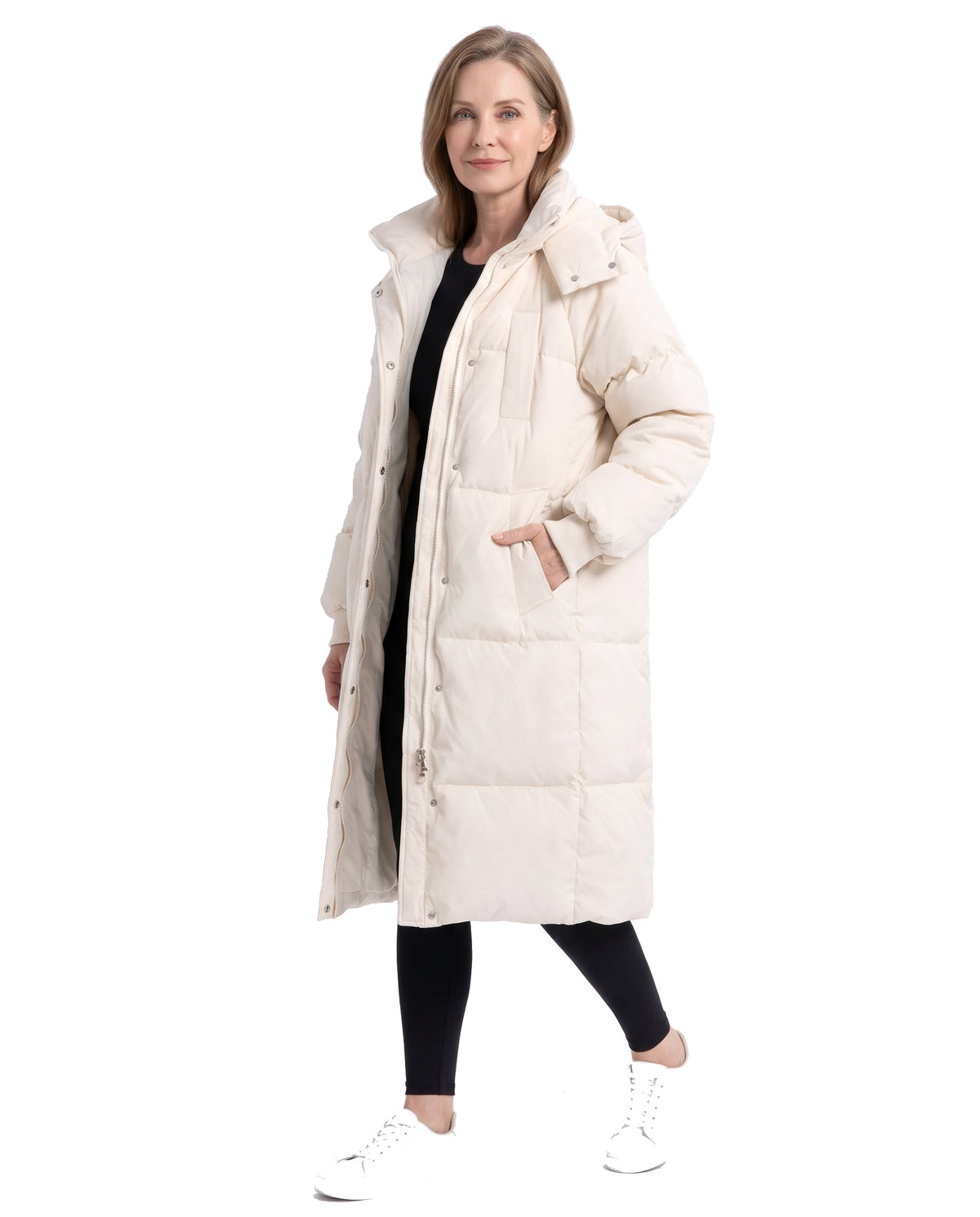Model wearing the cream white longline hooded puffer coat, three-quarter view