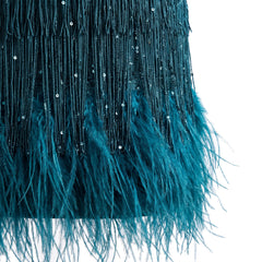 Close-up of the sequin fringe strands and the feather hem trim