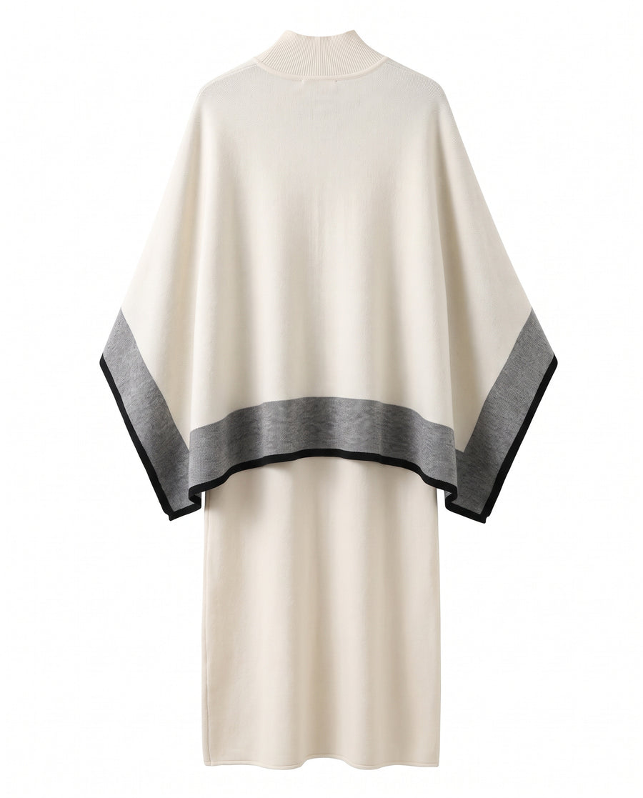 Back view of the cream knit midi dress and shawl cape set showing the grey border along the cape hem