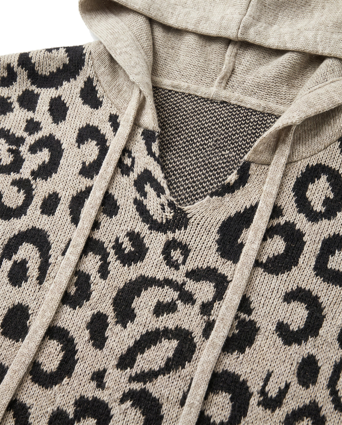 Close up of the V neck, drawstring ties and leopard knit stitch