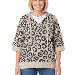 Woman wearing the khaki leopard hooded knit sweater with jeans, front view