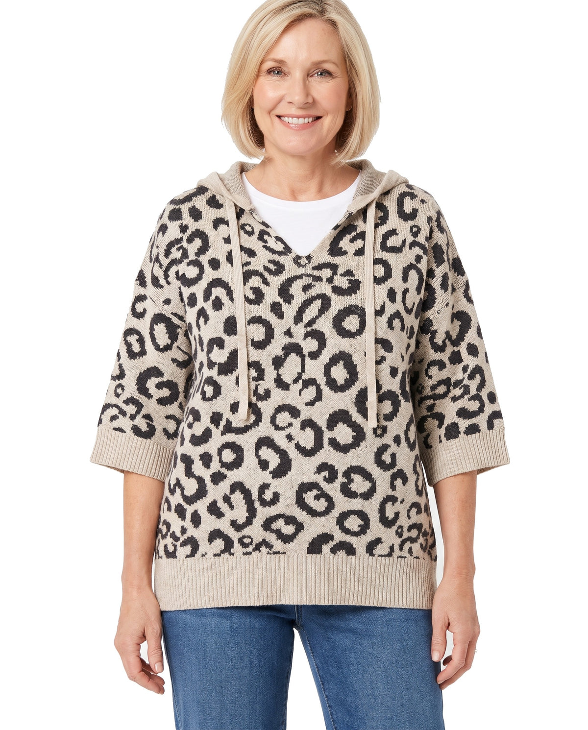 Woman wearing the khaki leopard hooded knit sweater with jeans, front view