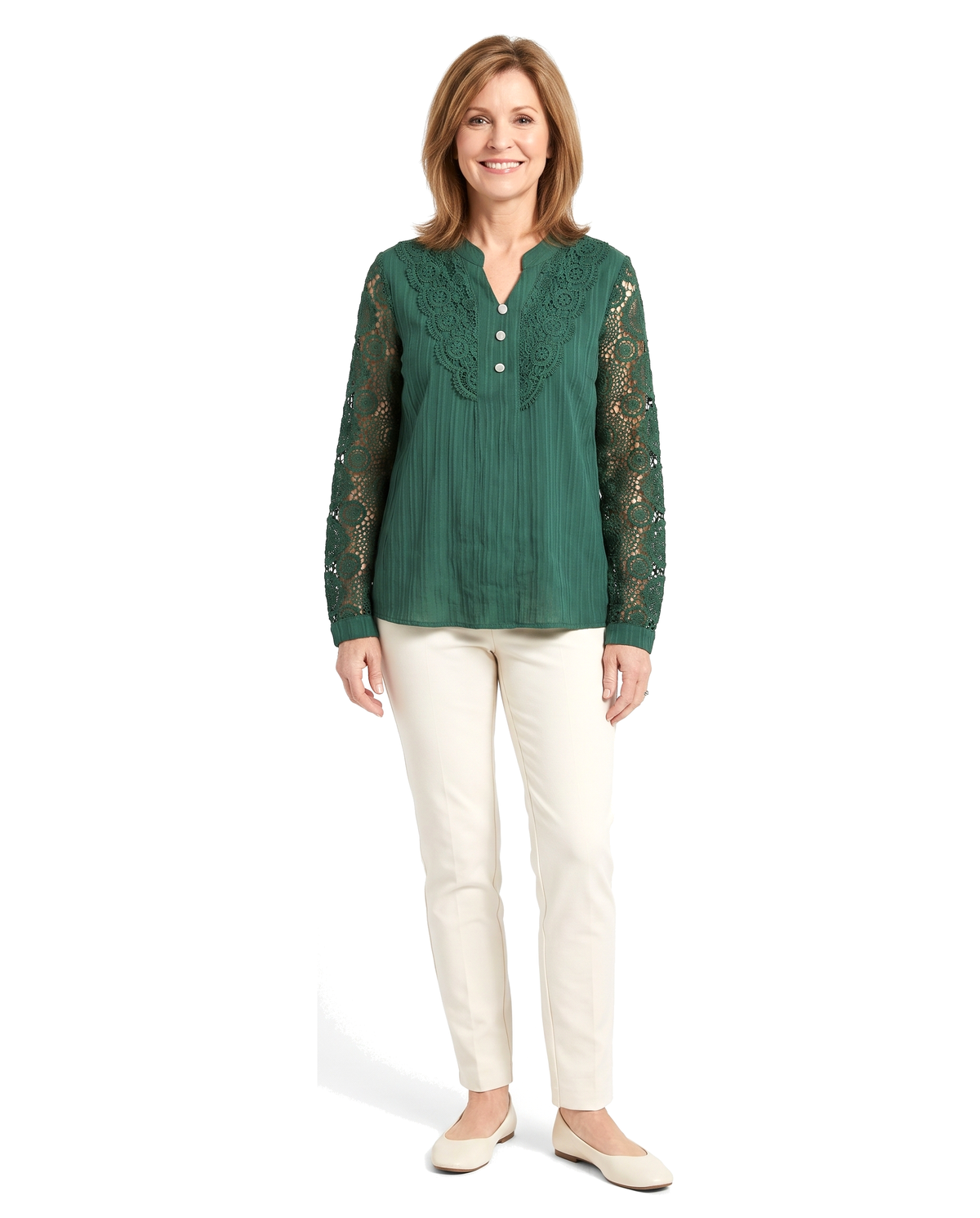 Woman wearing the green crochet lace blouse with cream trousers, standing front on