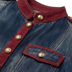 Close up of the burgundy stand collar, gold buttons and burgundy trimmed flap chest pocket