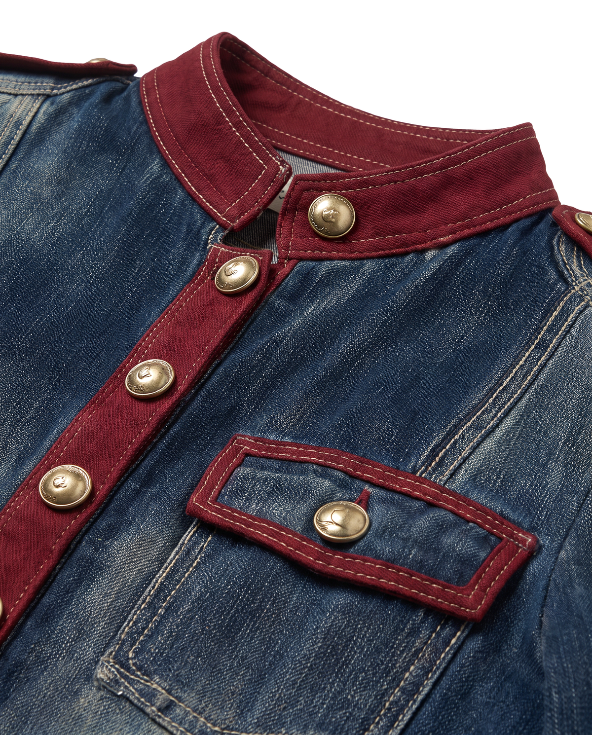 Close up of the burgundy stand collar, gold buttons and burgundy trimmed flap chest pocket