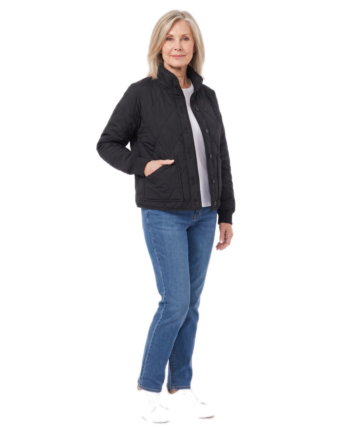 Woman wearing the black quilted bomber jacket, three quarter pose