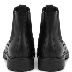 Women's black lug sole Chelsea boots, back view