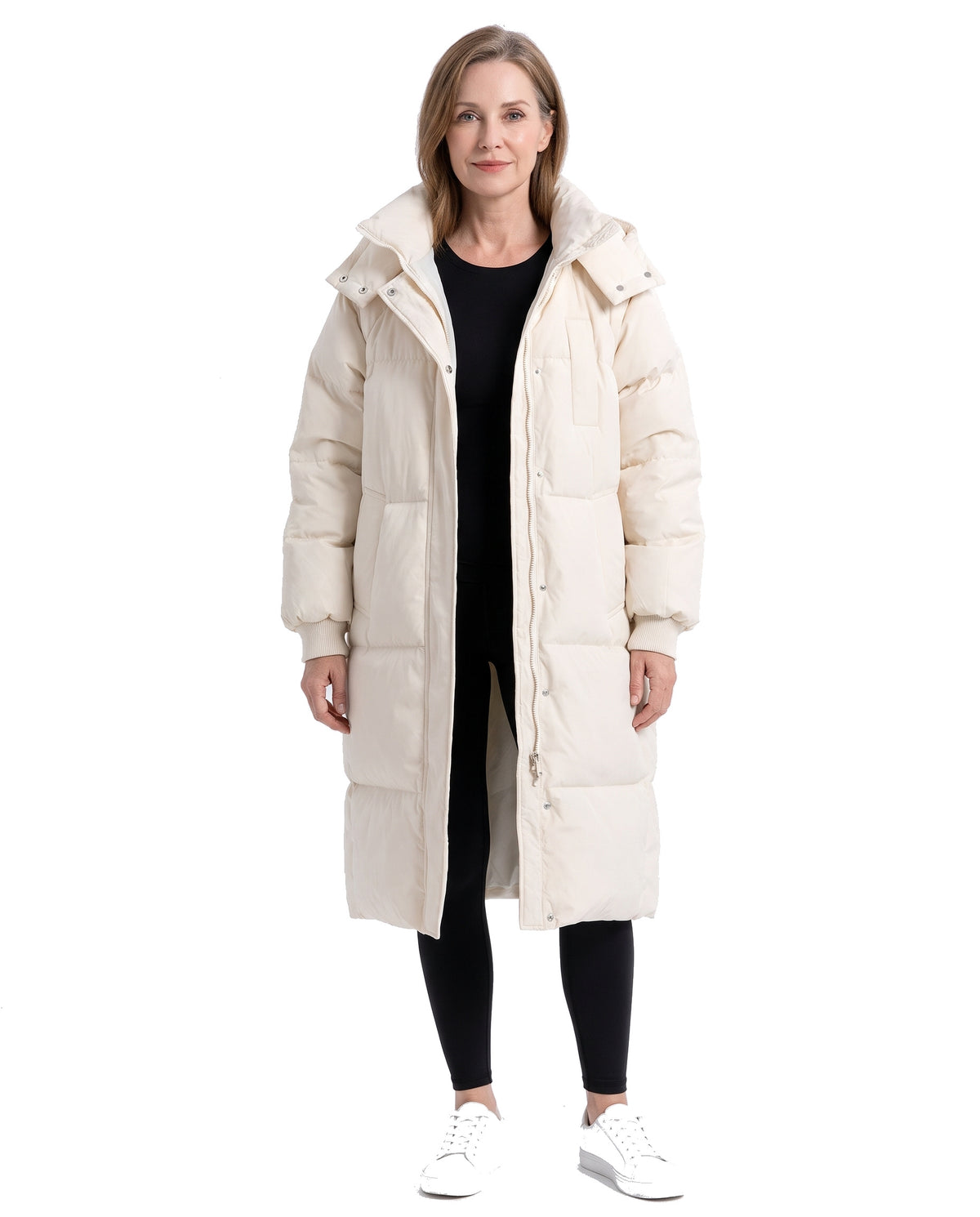 Model wearing the cream white longline hooded puffer coat, front view