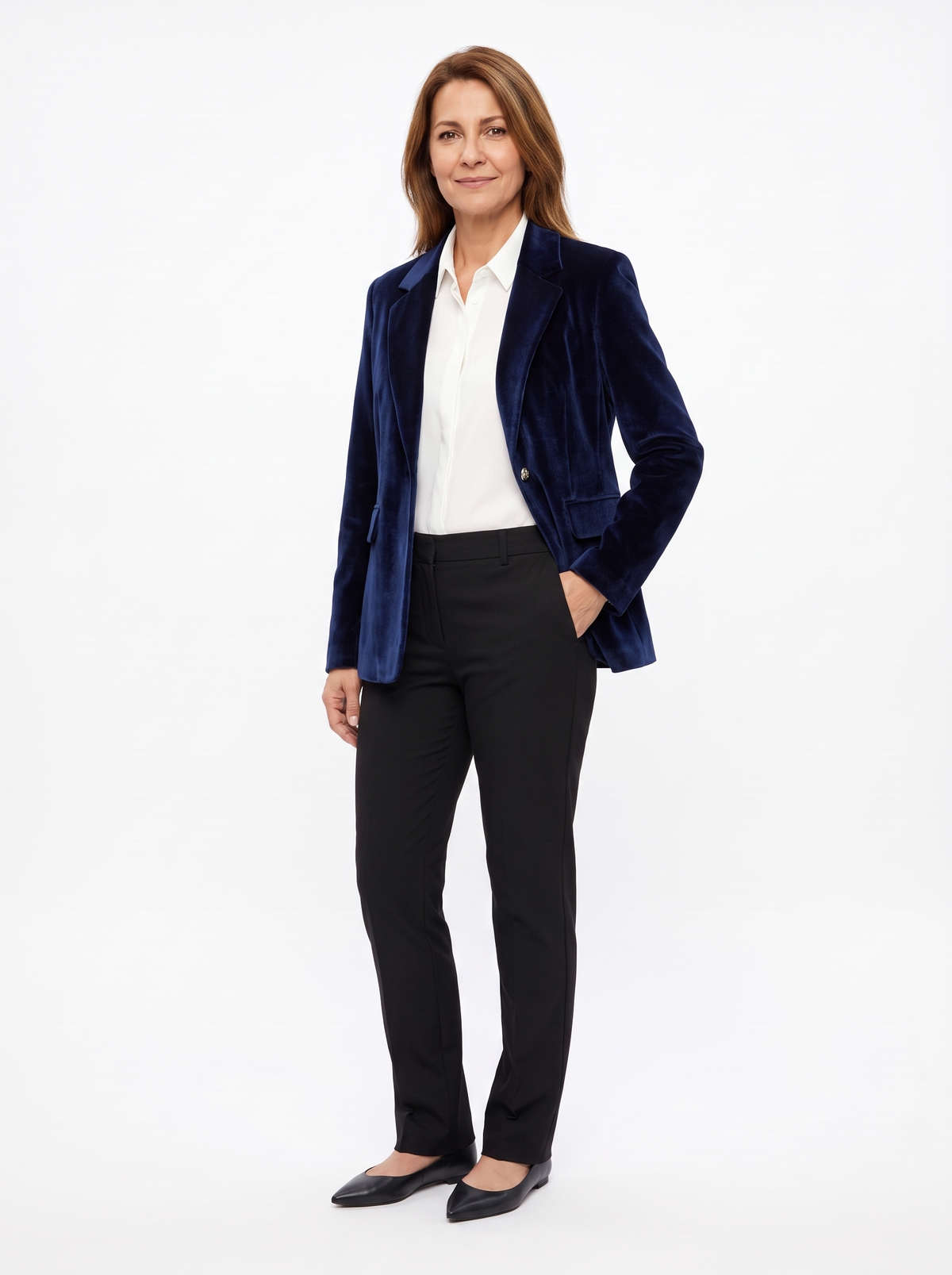 Woman wearing the navy velvet blazer open over a white shirt