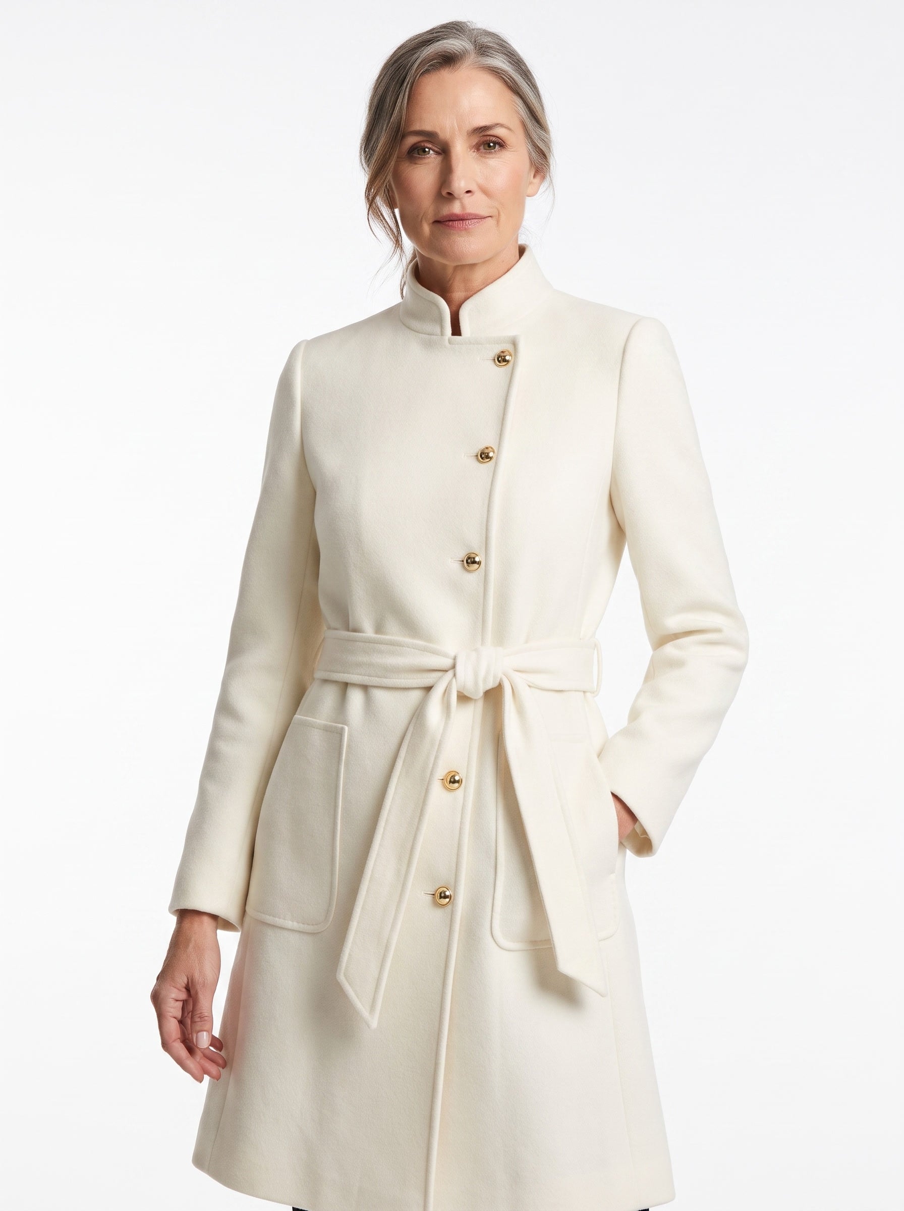 Olive Women's Belted Wool-Blend Trench Coat in ivory, worn by a model, studio white background