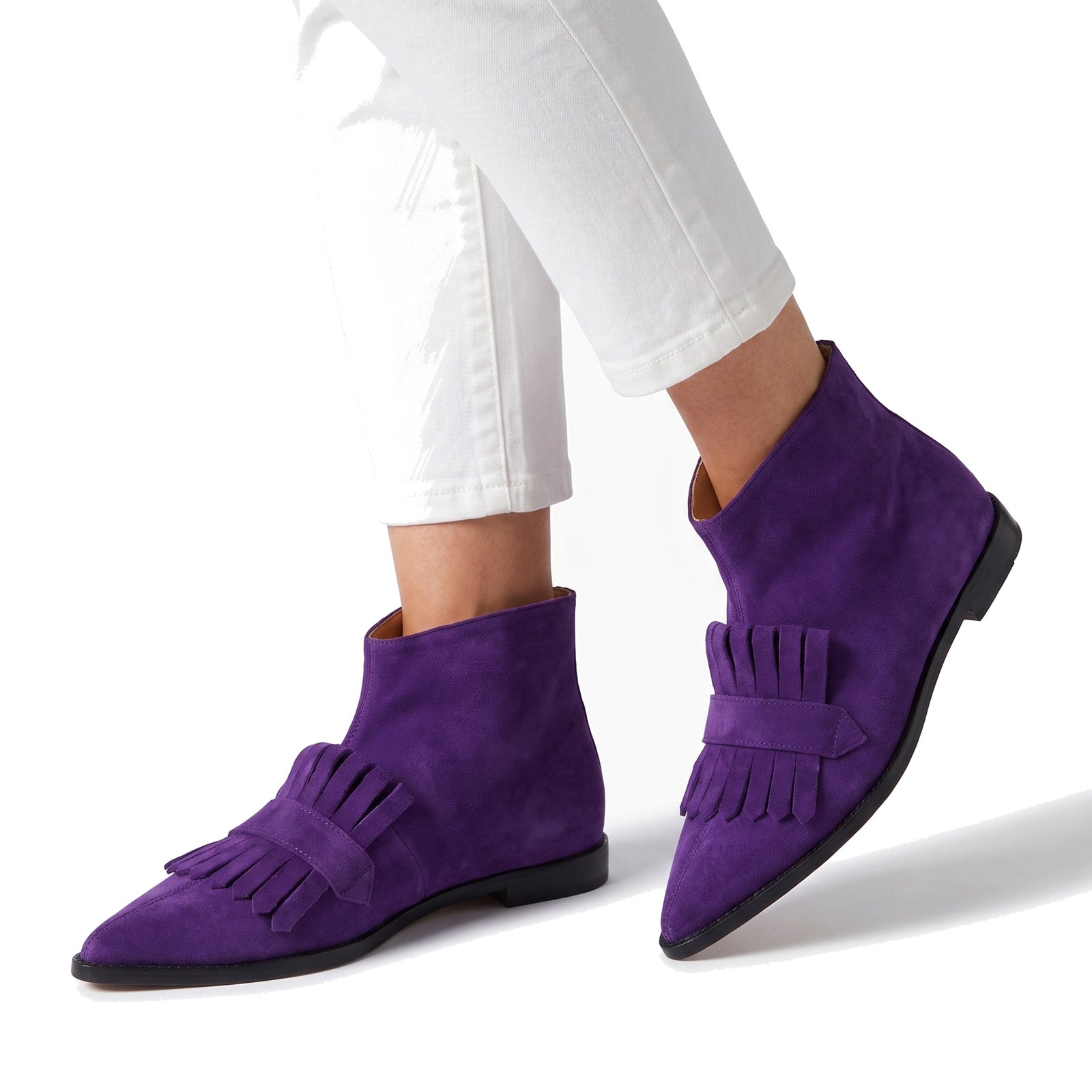 Selma Women's Suede Fringe Ankle Boots in purple worn with white cropped trousers