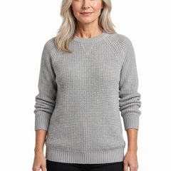 Woman wearing the Pearl-Bernadette textured crew neck sweater in light gray