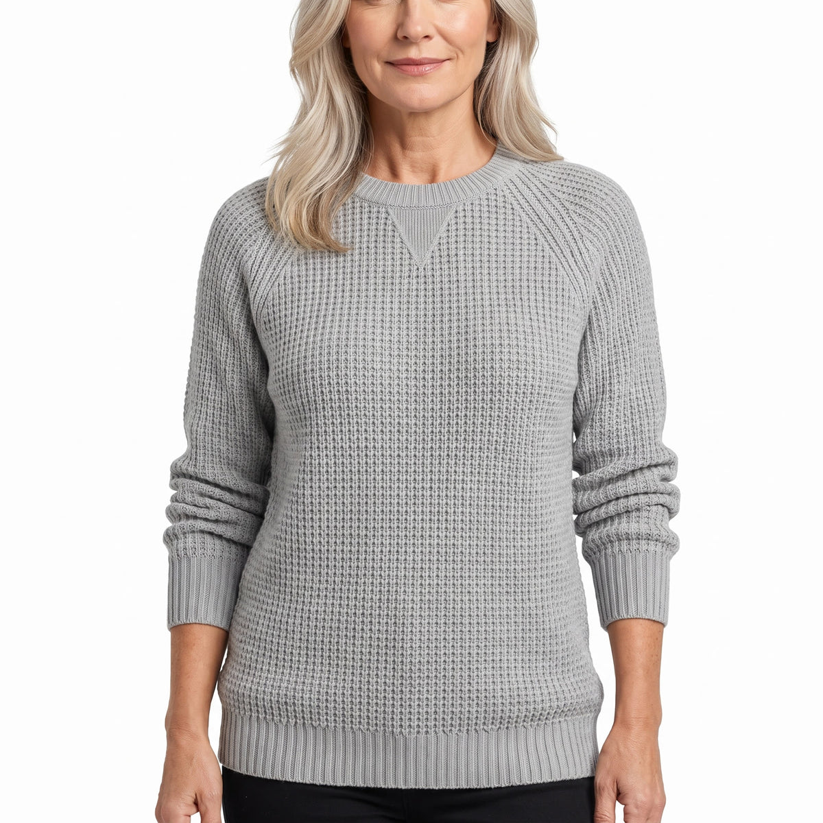 Woman wearing the Pearl-Bernadette textured crew neck sweater in light gray