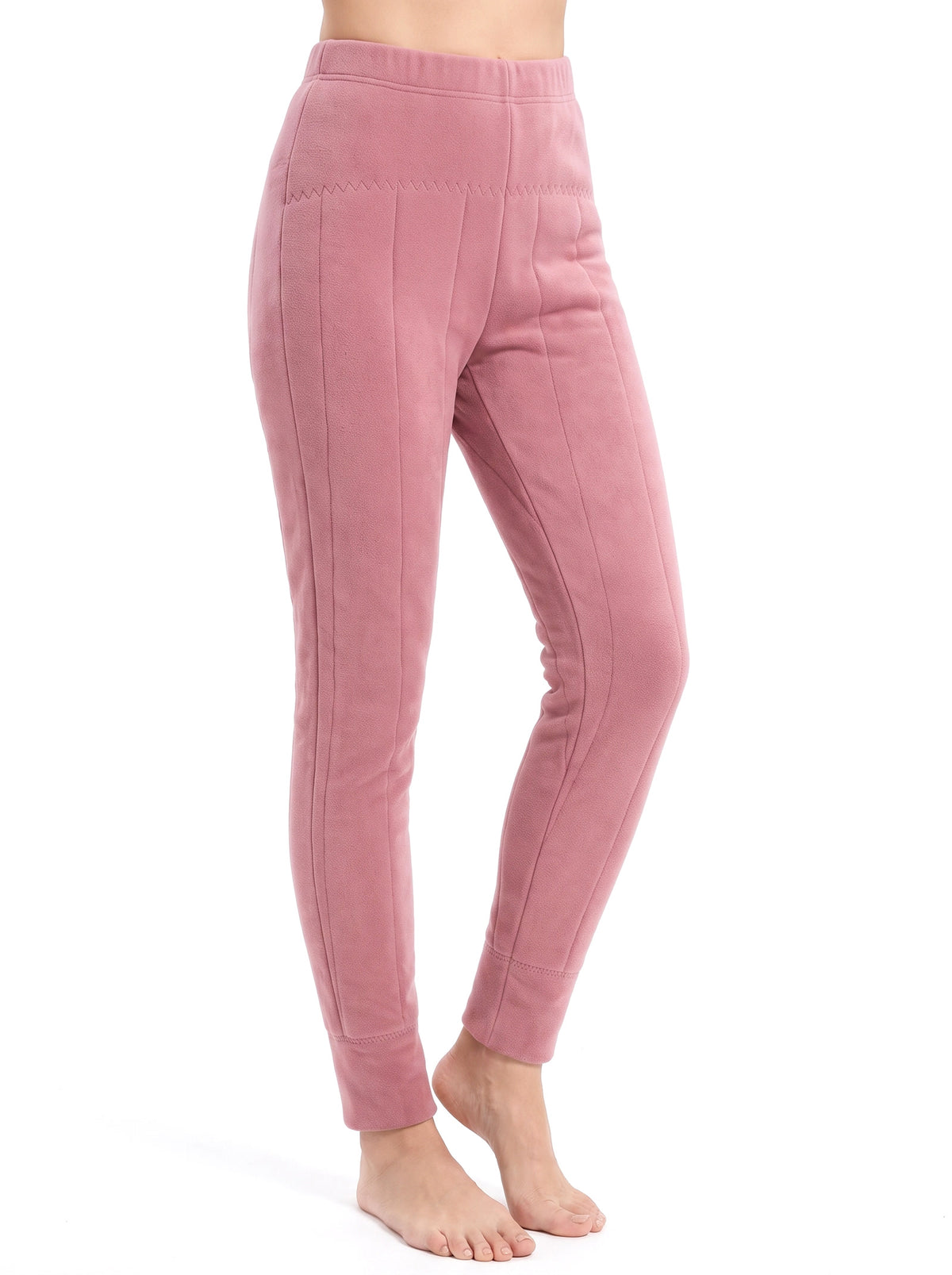 Woman wearing dusty pink quilted wool fleece lined dress pants, studio white background
