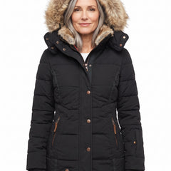 Minerva Women's Cosy Hooded Puffer Jacket in Black worn by a model, faux fur lined hood