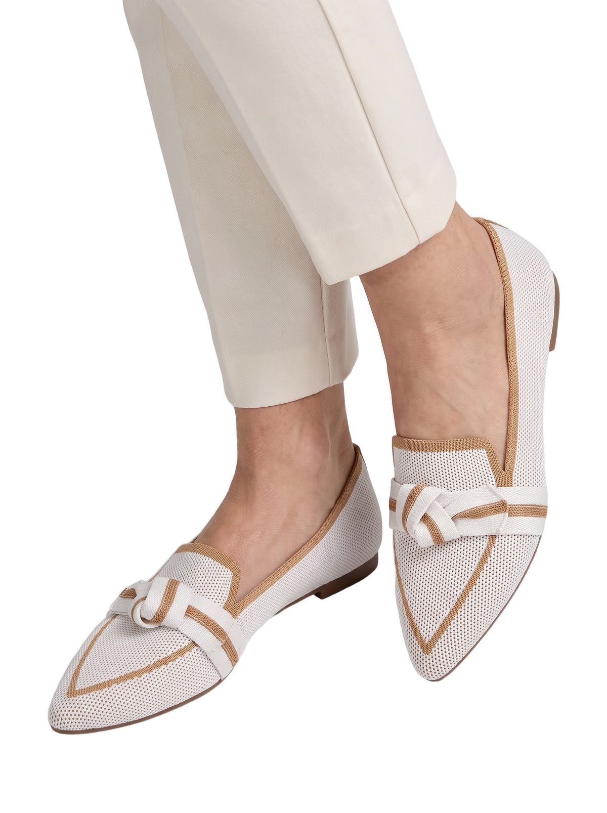 Sabine Women's Knit Pointed-Toe Loafers in White worn by a model, close-up on white background