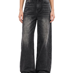 Odette Women's Wide-Leg Flared Jeans in Black, worn by a model, front view