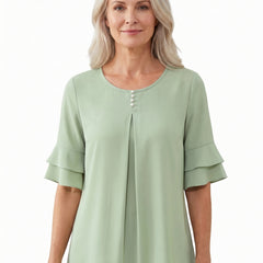 Olive Women's Pleated Chiffon Tunic Blouse in light green worn by a model, front view