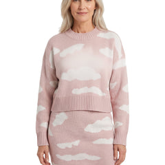 Woman wearing pink cloud print knit jumper and skirt set