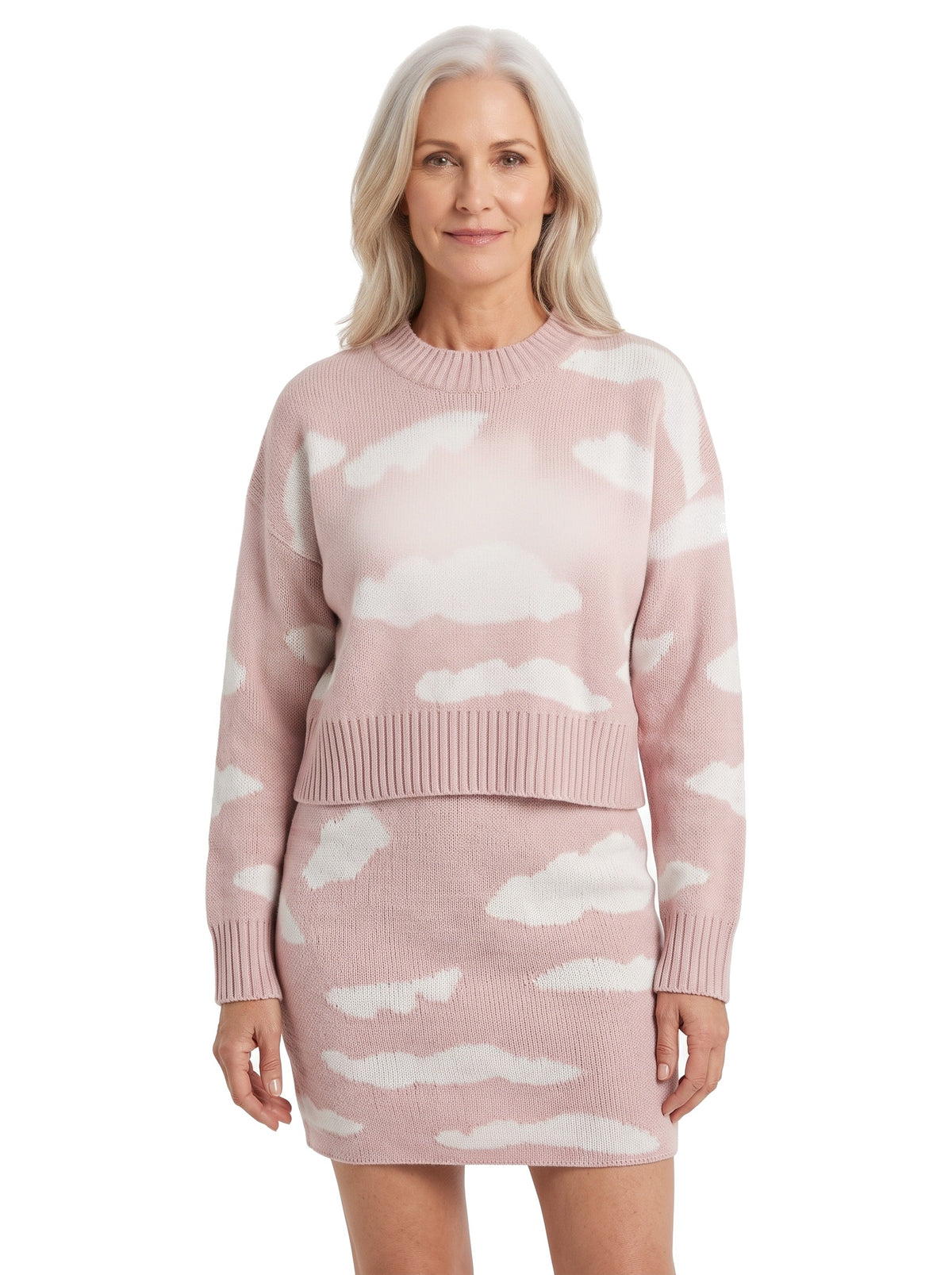 Woman wearing pink cloud print knit jumper and skirt set