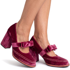 Women's berry velvet bow-tie Mary Jane block heel loafers worn on bare feet