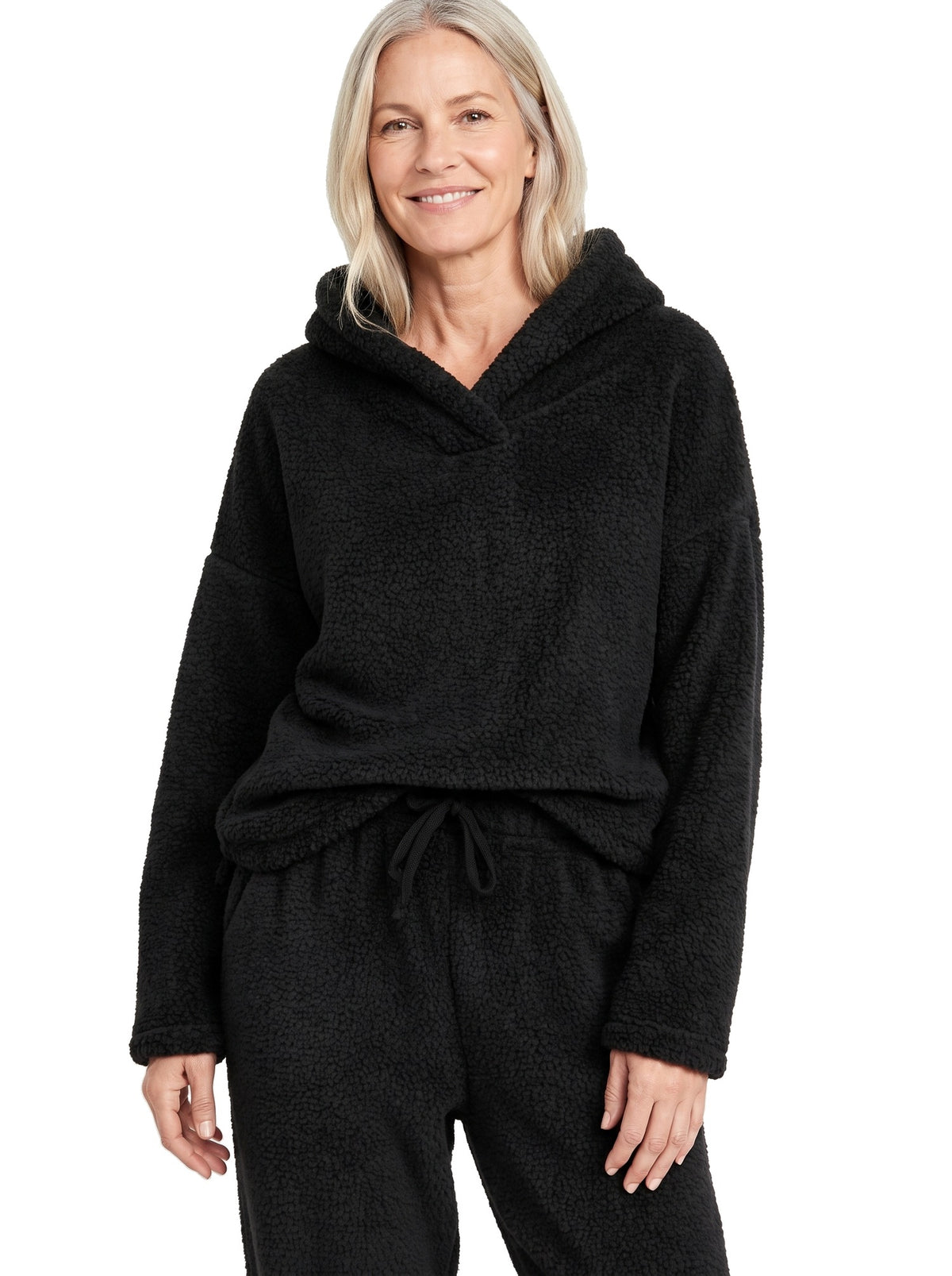 Woman wearing the black shawl-collar teddy fleece lounge set