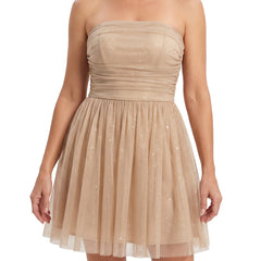 Woman wearing champagne gold glitter pleated bustier mini dress