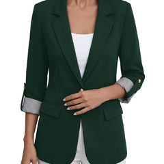 Women's roll-tab sleeve blazer in dark forest green, worn open over a white top