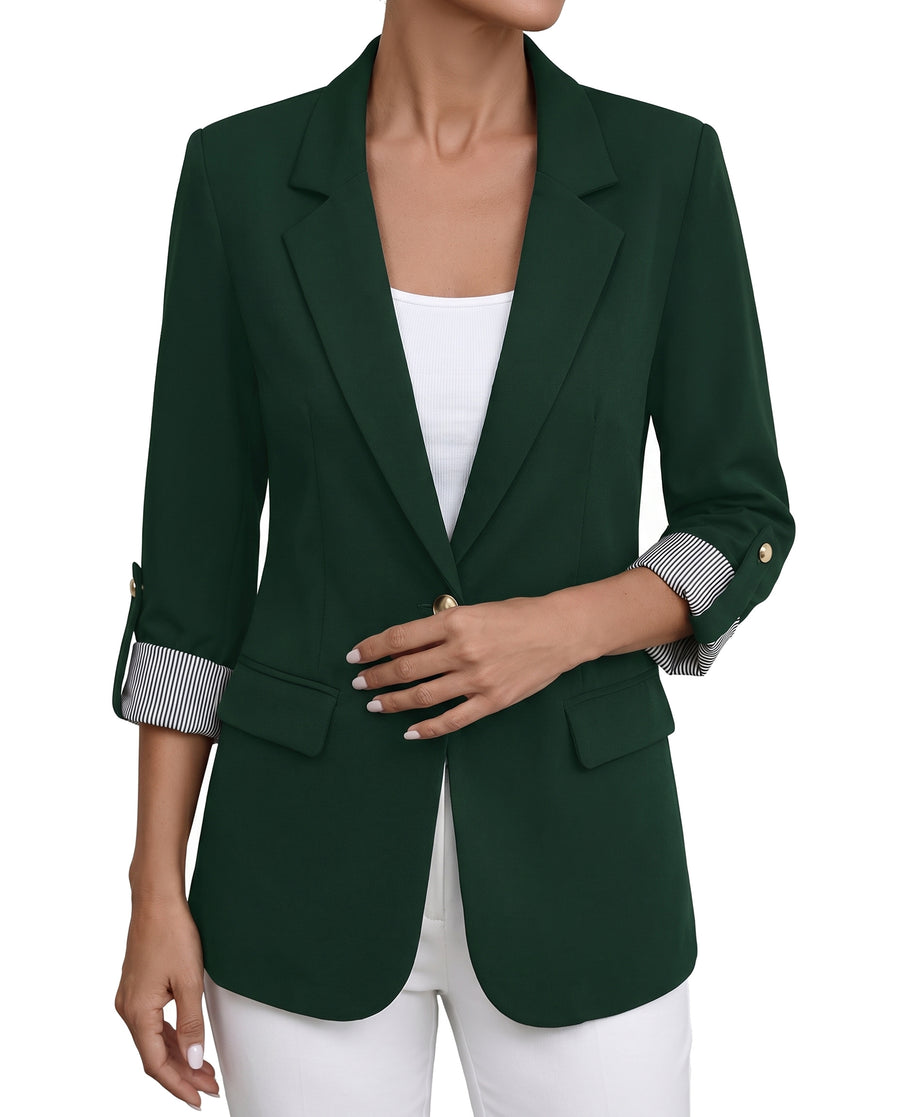 Women's roll-tab sleeve blazer in dark forest green, worn open over a white top
